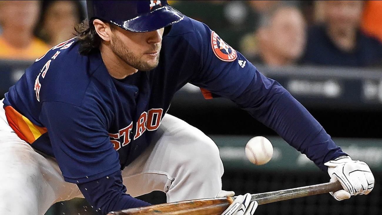 Houston Astros' Jake Marisnick lays down a bunt for a foul in the fifth inning of a baseball game against the Oakland Athletics, Sunday, July 10, 2016, in Houston.