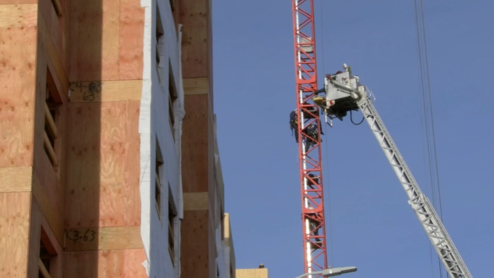 Crane rescue: Firefighters pull man to safety after he got stuck dozens of feet in the air in Durham - Vimarsana News