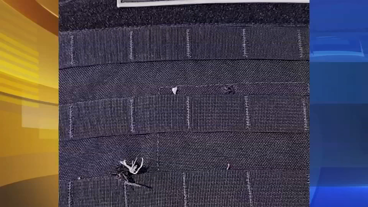 Police officer injured after bullet ricochets off ballistic vest
