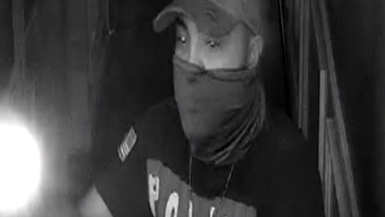 Man wearing shirt with 'police' on front sought in armed robbery
