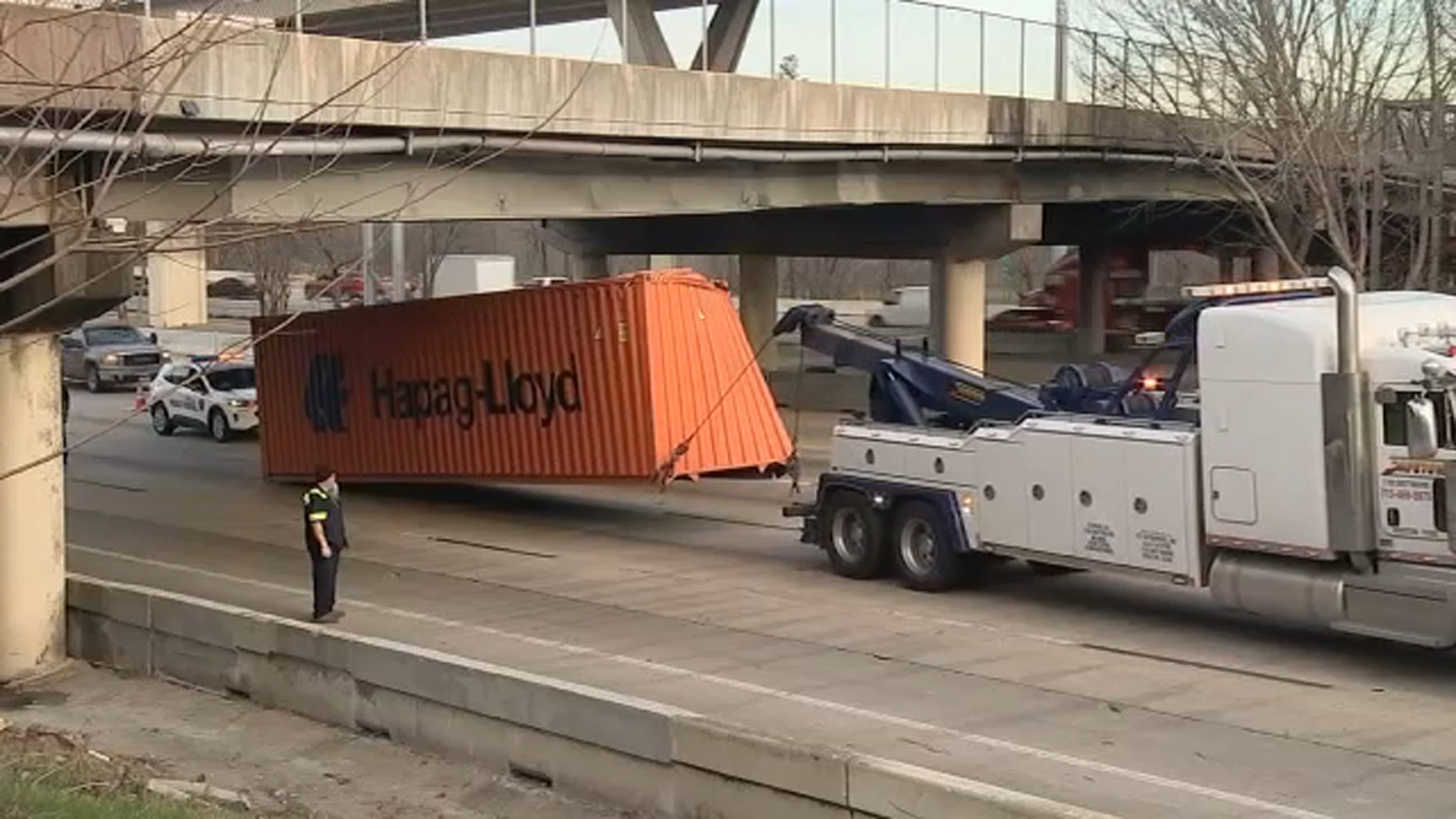 Katy Freeway lanes reopened after 18-wheeler loses container, HPD says