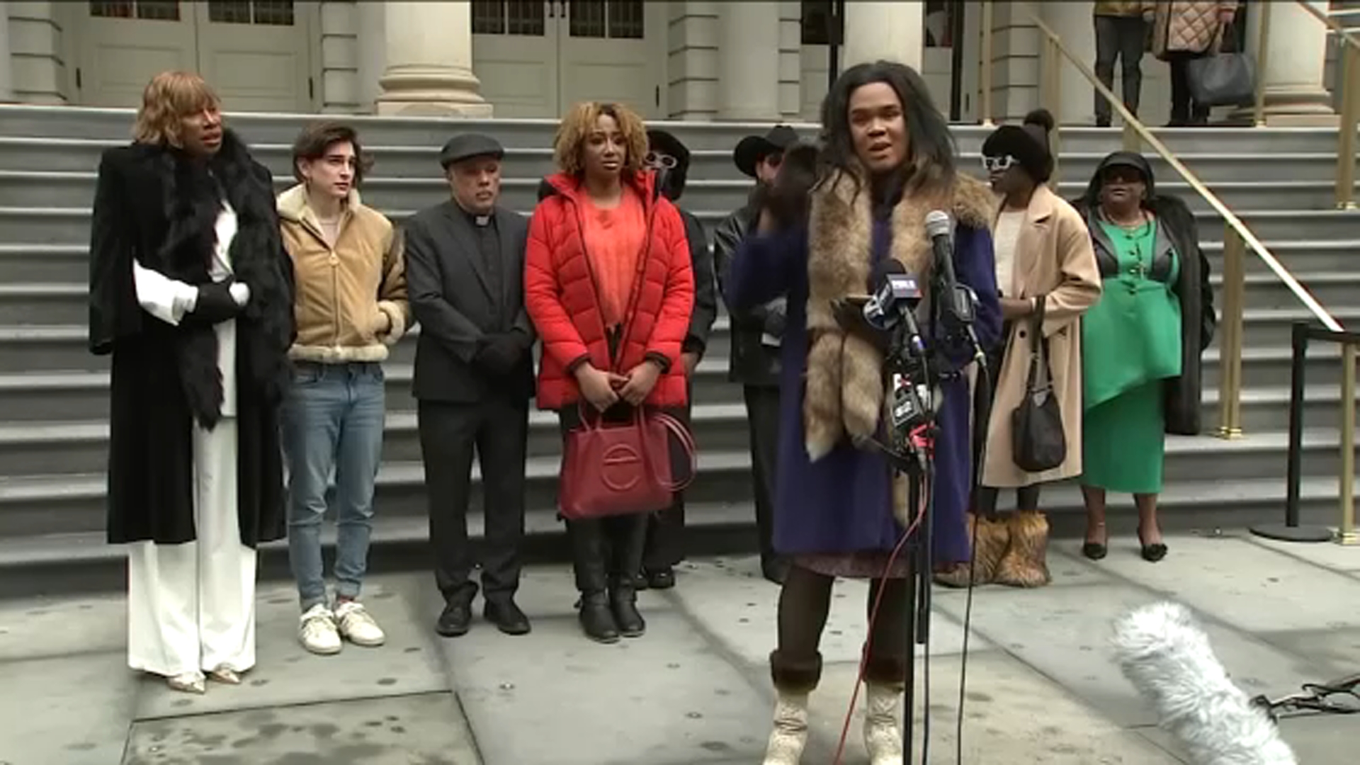 Rally demands apology from Archdiocese after controversial funeral