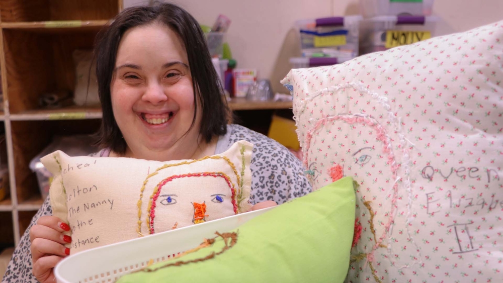 Artist with Down syndrome shares colorful pillows with the world