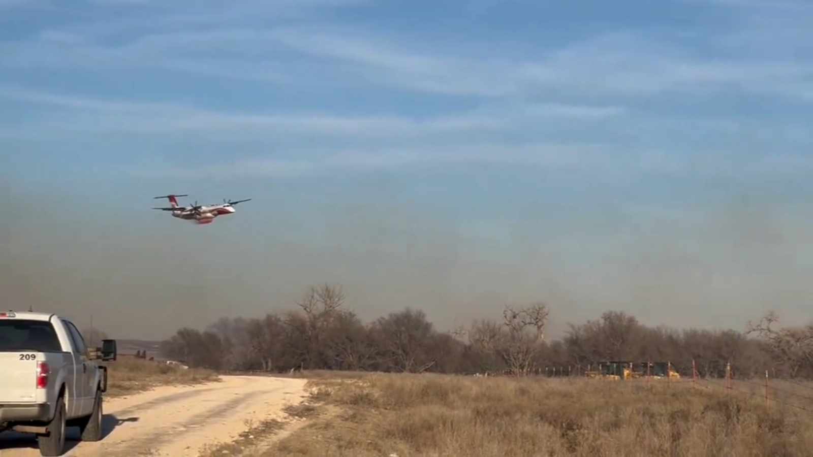 Texas struggles to contain wildfires as wind threatens to further their spread
