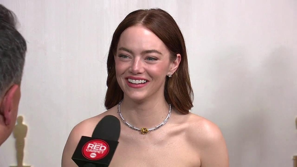Emma Stone speaks on the Oscars red carpet