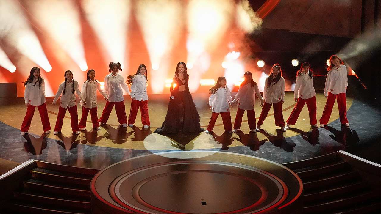 Becky G, center, performs the song "The Fire Inside" from the movie "Flaming Hot" during the Oscars on Sunday, March 10, 2024, at the Dolby Theatre in Los Angeles.