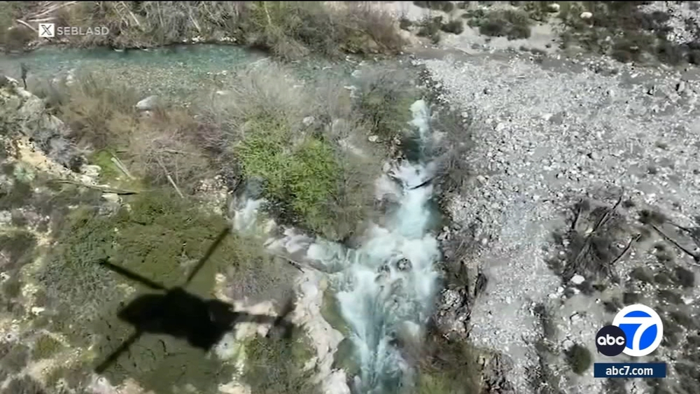 Missing hiker feared dead after being swept away in river
