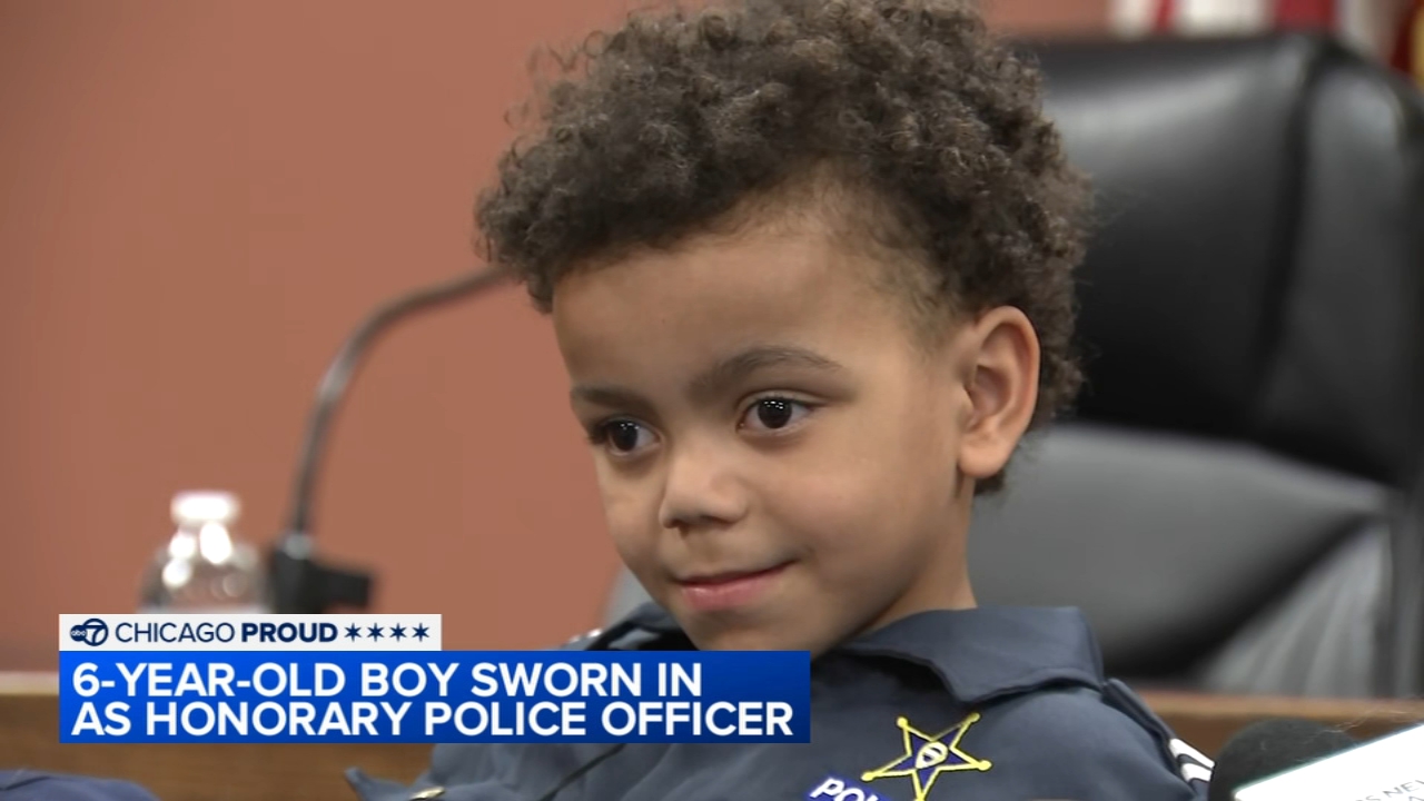 Boy becomes honorary officer after dozens of surgeries, procedures