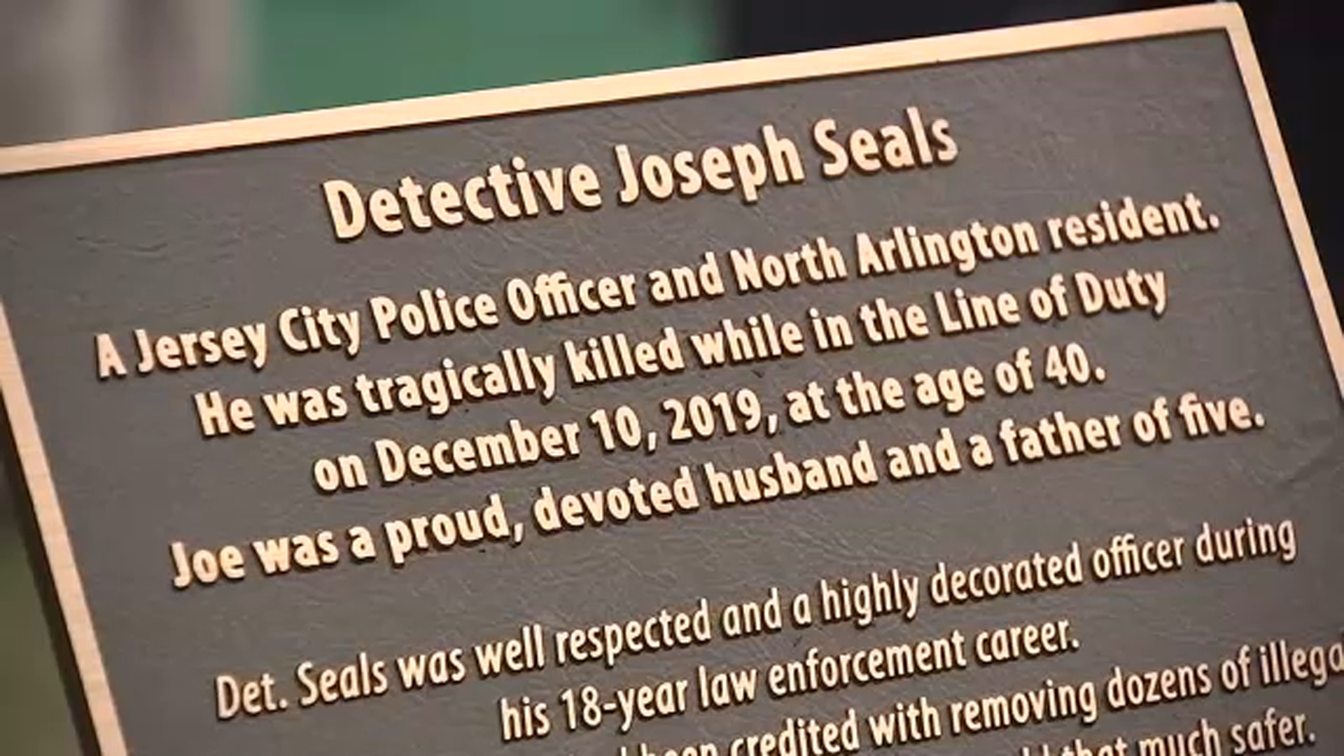 Plaque dedicated to fallen detective at North Arlington, New Jersey playground
