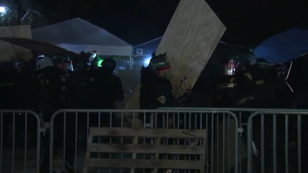 Police begin breaking down encampment at UCLA