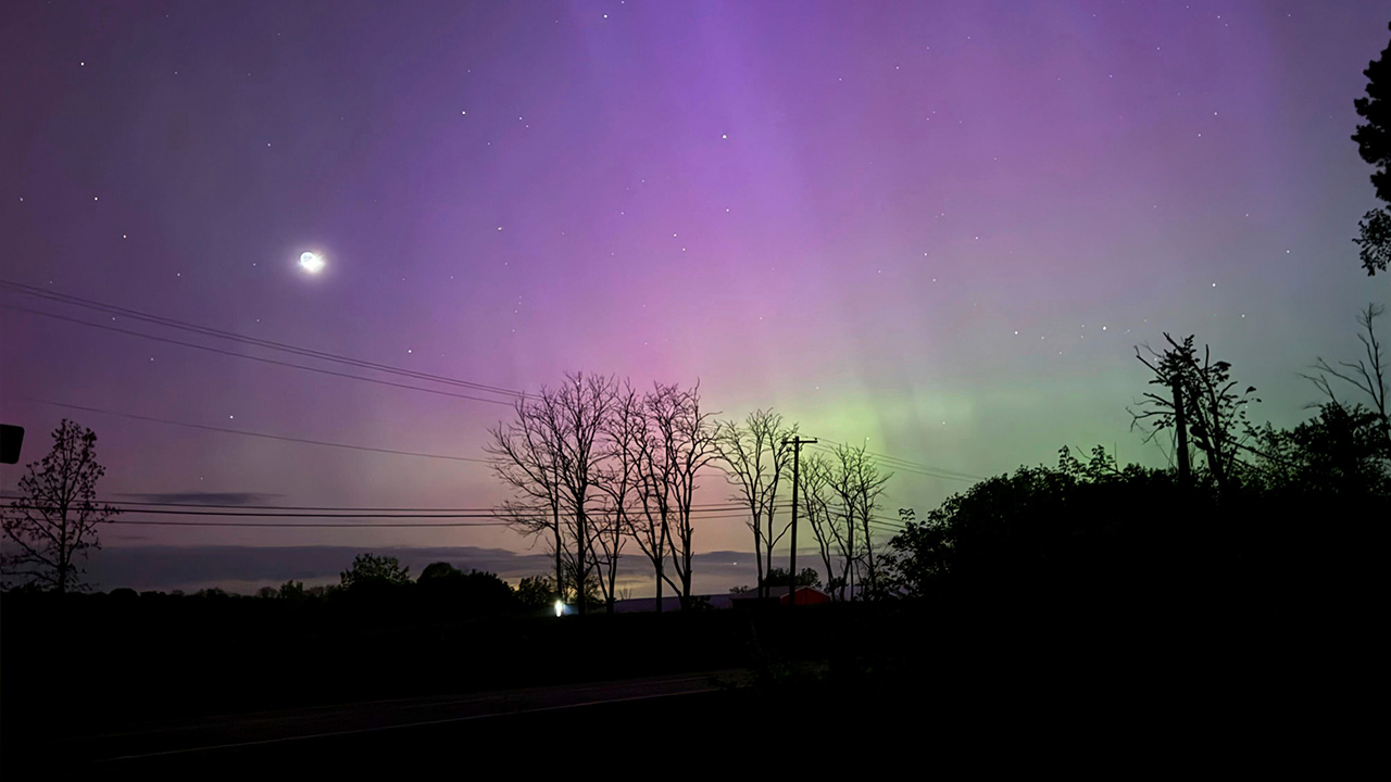 The Aurora Borealis, also known as the Northern Lights, is visible over Ann Arbor, Michigan.
