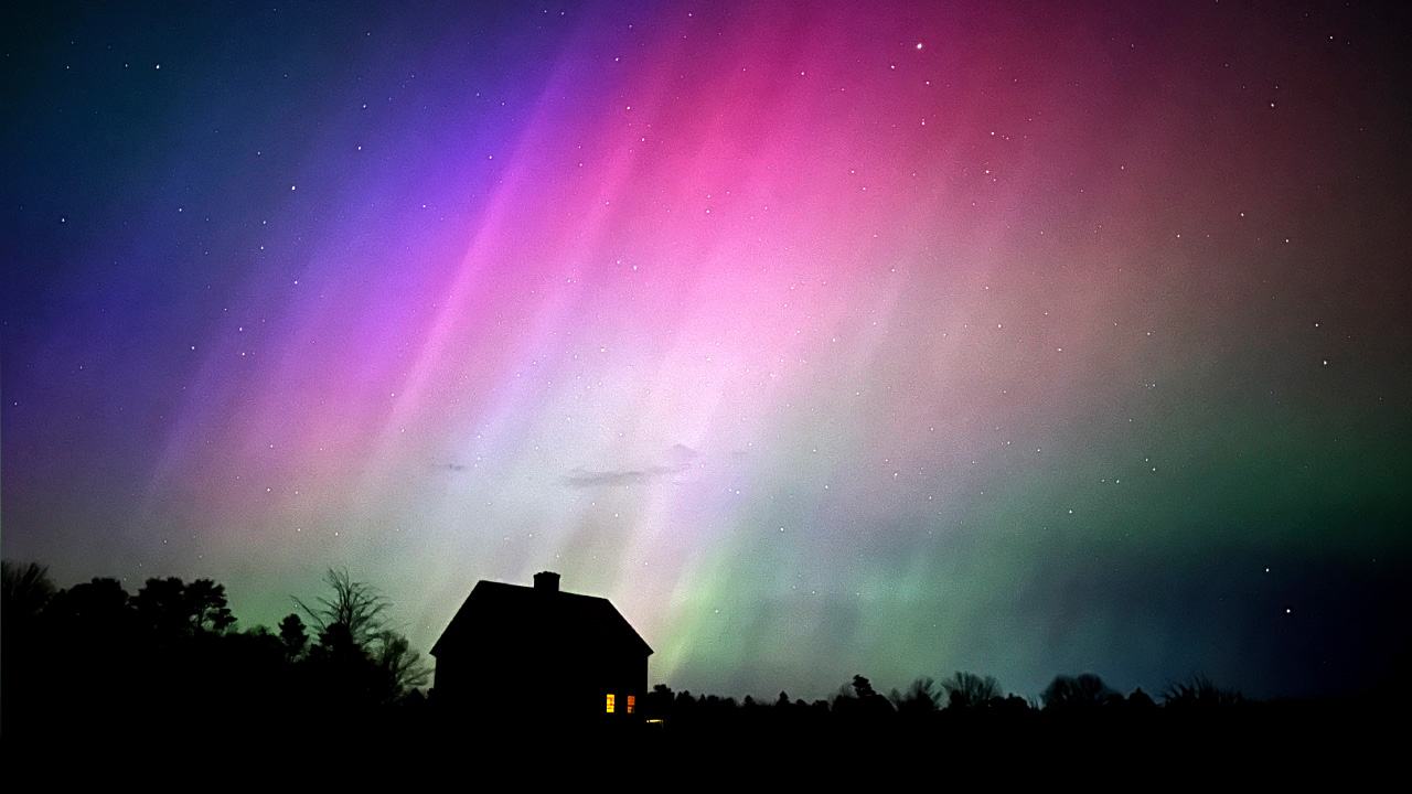 The Northern Lights flare in the sky over a farmhouse in Brunswick, Maine.