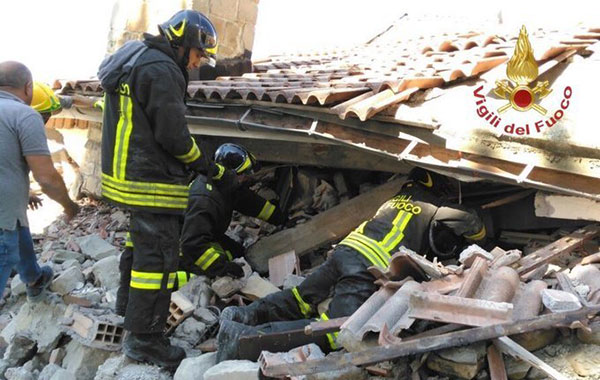 Italian firefighters search for survivors under the rubble of the town of Amatrice, central Italy, Wednesday, Aug. 24, 2016 following an earthquake.