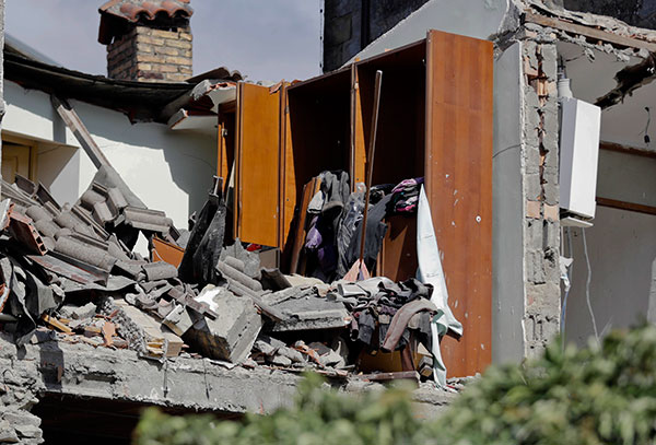 What remains of an house interior is covered with rubble following an earthquake in Accumuli, central Italy, Wednesday, Aug. 24, 2016.