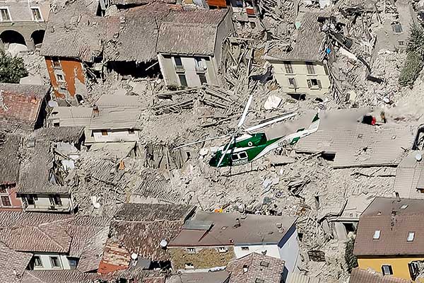 Rescuers search amid rubble following an earthquake in Amatrice, central Italy, Wednesday, Aug. 24, 2016.