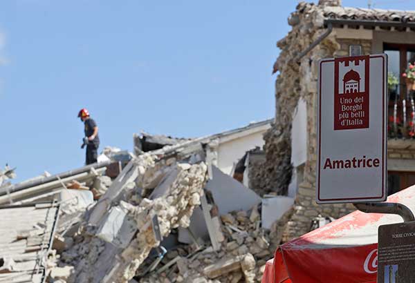 Rescuers work in Amatrice, central Italy, Wednesday, Aug. 24, 2016, where a magnitude 6 quake struck at 3:36 a.m. (0136 GMT)
