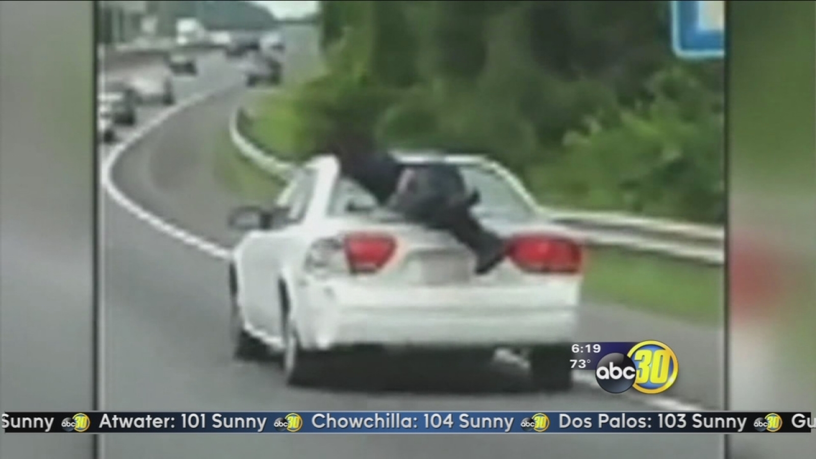 Caught on camera Man rides on trunk of car down interstate ABC30 Fresno