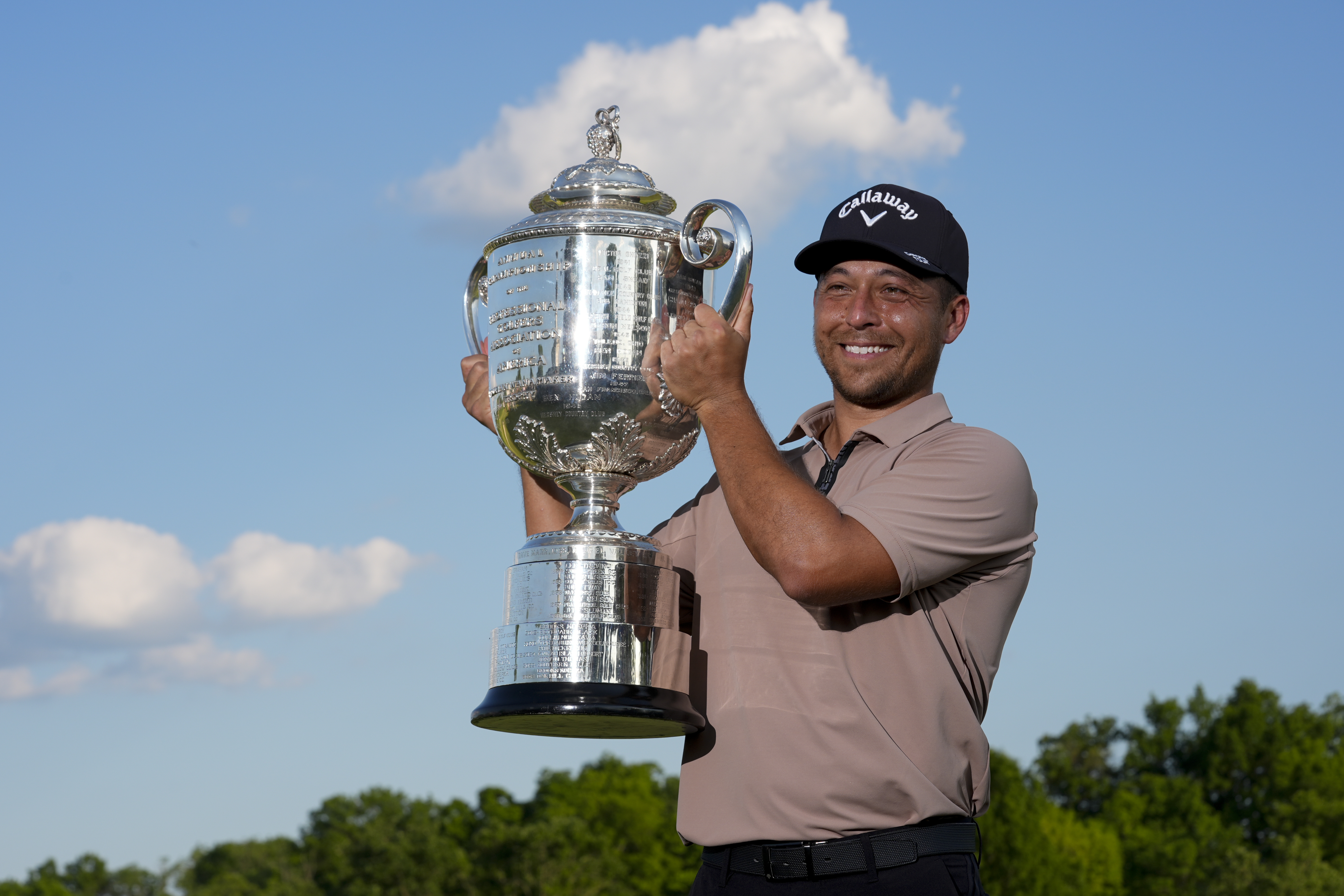 Xander Schauffele holds the Wanamaker trophy after winning the PGA Championship golf tournament at the Valhalla Golf Club, Sunday, May 19, 2024, in Louisville, Ky.