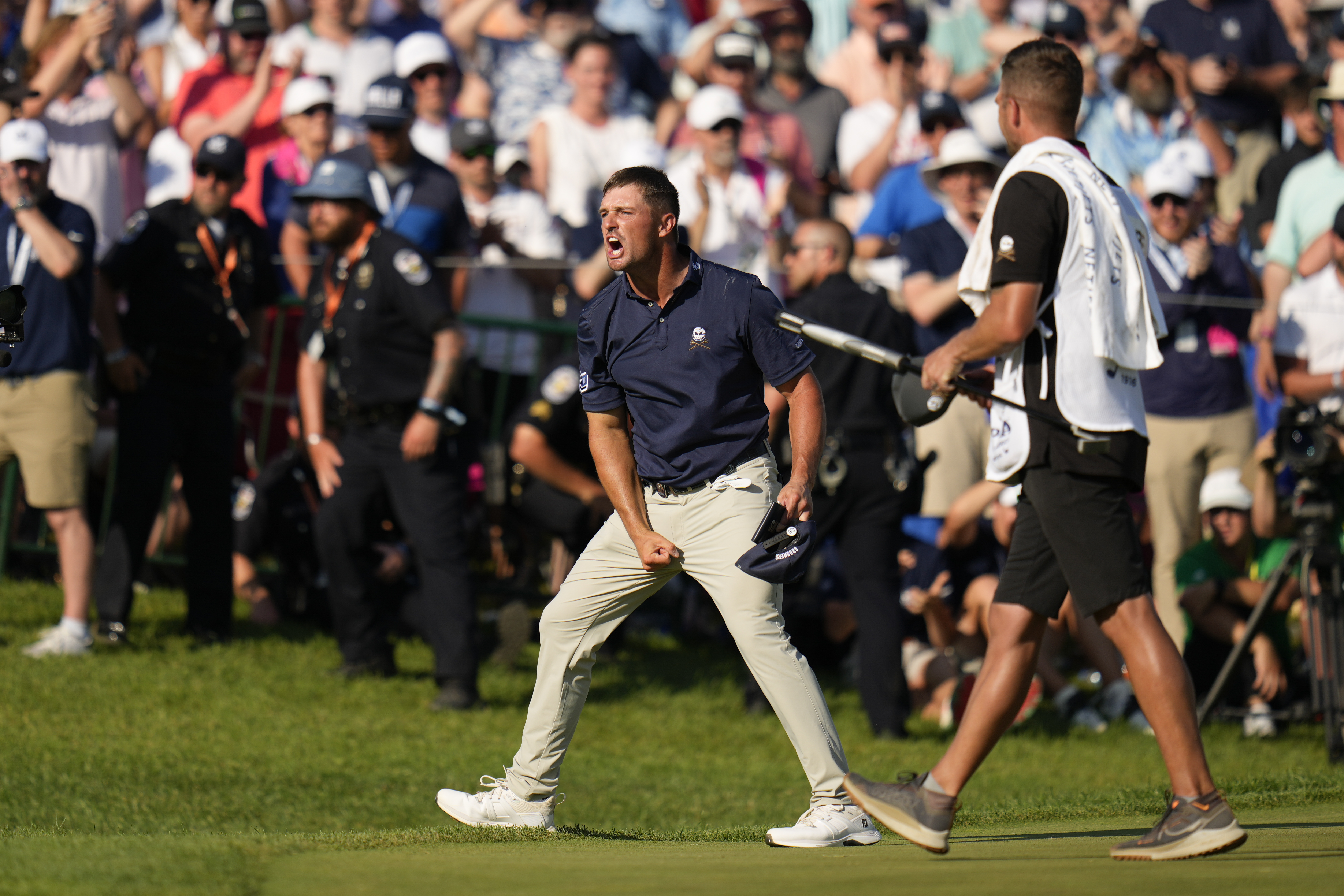 Bryson DeChambeau celebrates after a birdie on the 18th hole during the final round of the PGA Championship golf tournament at the Valhalla Golf Club.