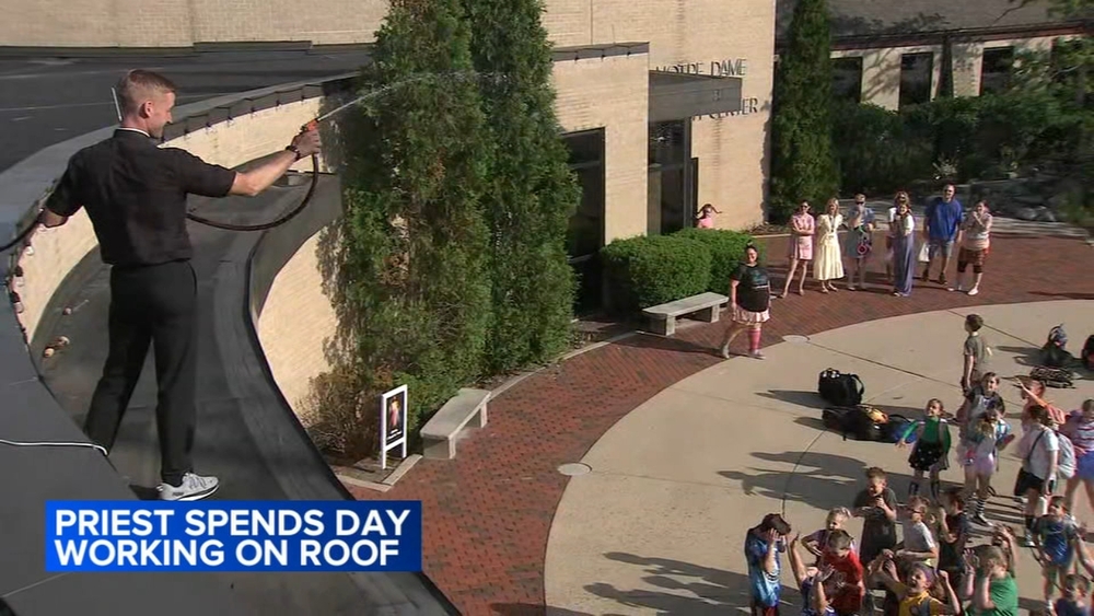 Clarendon Hills priest spends day up on roof