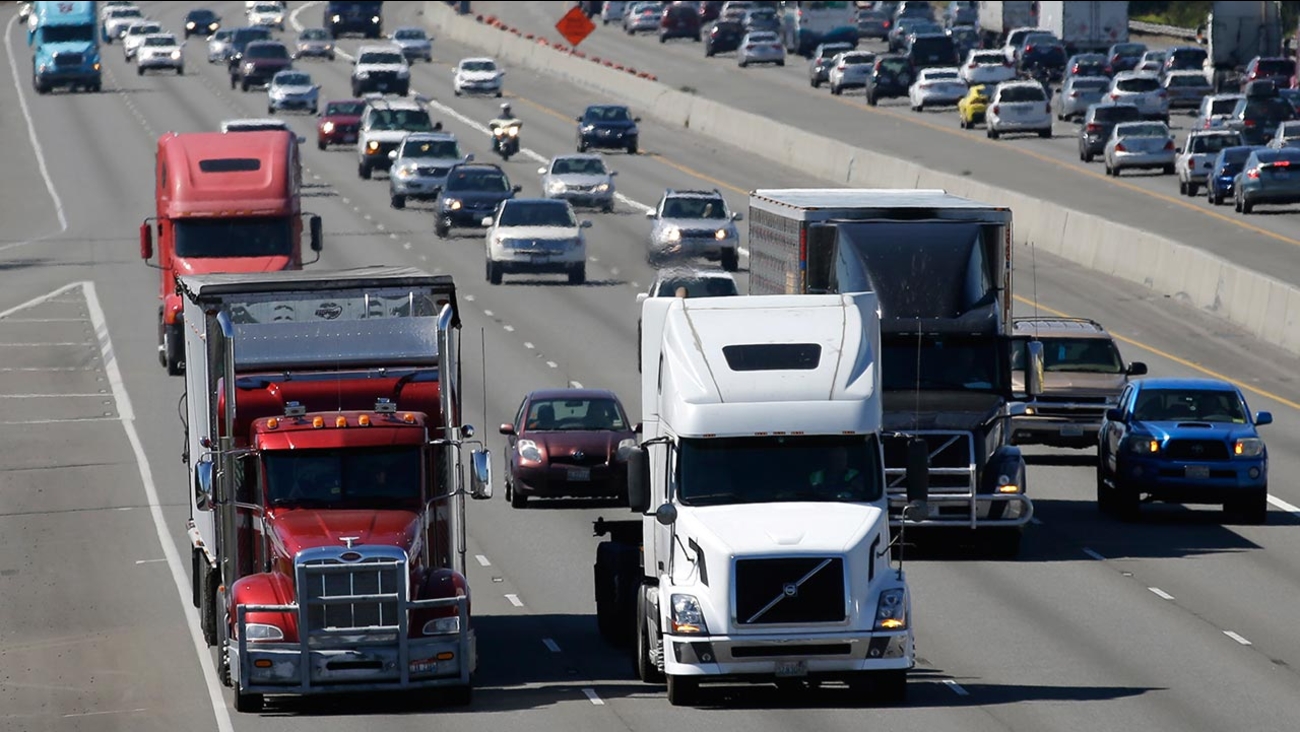 In this Wednesday, Aug. 24, 2016, photo, truck and automobile traffic mix on Interstate 5, headed north through Fife, Wash., near the Port of Tacoma.