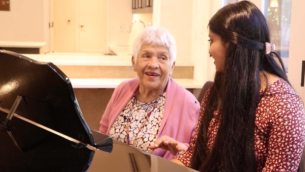 Senior citizens learn to play piano courtesy of talented teenager