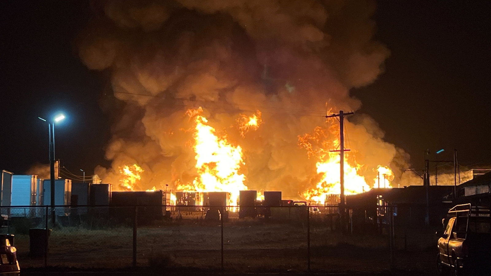 Large fire contained at pallet yard in Fresno County