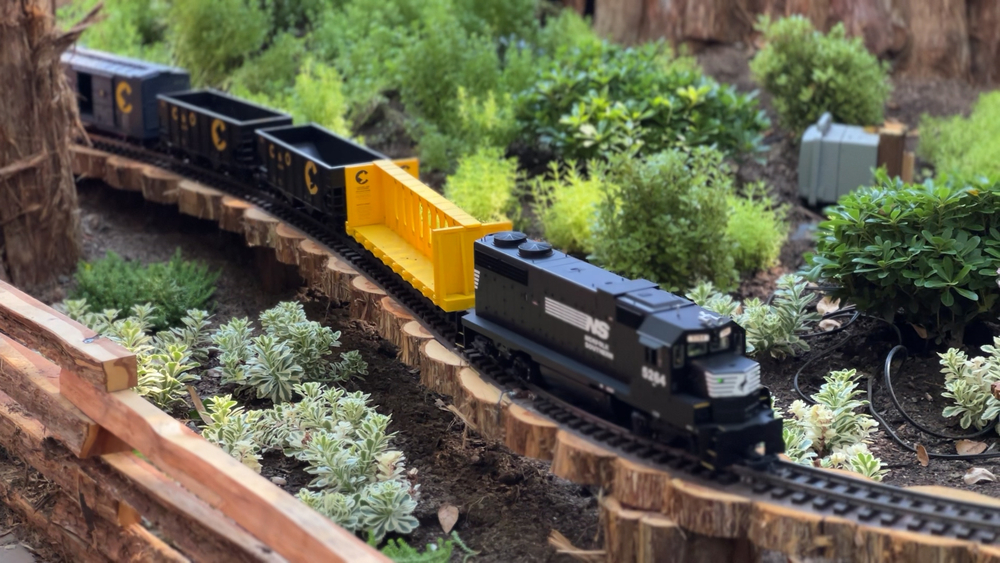 Model railroad takes guests on a whimsical journey in botanical garden