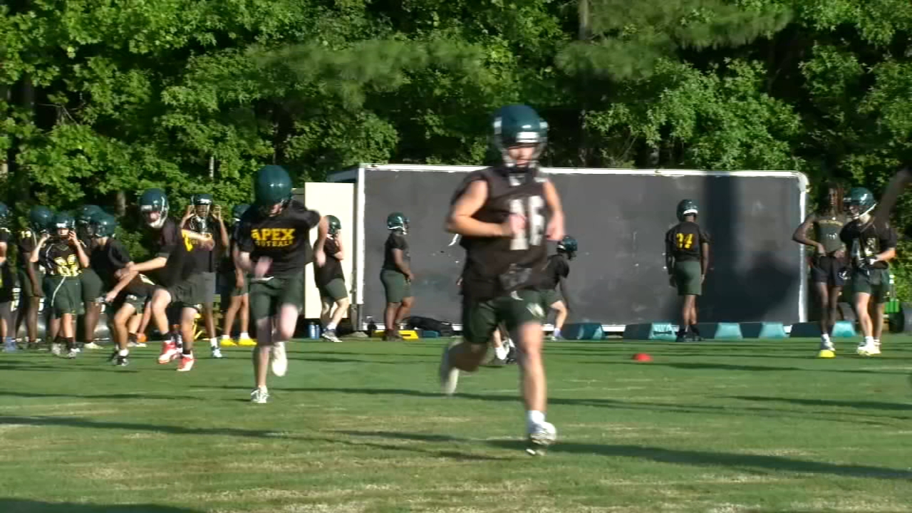 Student athletes train in the summer heat for fall season