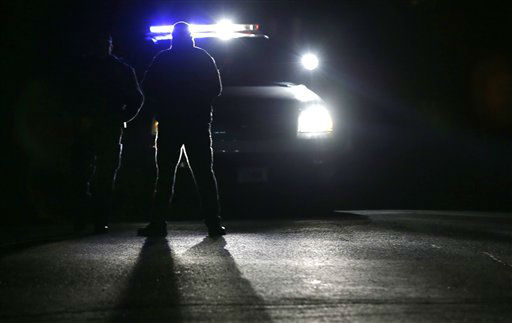 Police block access to Yogonanda St., the neighborhood of both a student shooting victim, Dylan Hockley, and the shooter, Adam Lanza, in Newtown, Conn., Saturday, Dec. 15, 2012. The Lanza family's residence is across the street from the Hockley family's residence. A gunman opened fire at Sandy Hook Elementary School in the town, killing 26 people, including 20 children before killing himself on Friday. (AP Photo/Charles Krupa)