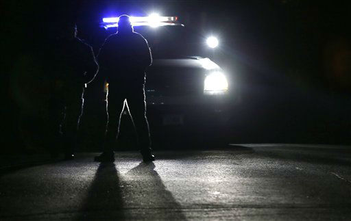 Police block access to Yogonanda St., the neighborhood of both a student shooting victim, Dylan Hockley, and the shooter, Adam Lanza, in Newtown, Conn., Saturday, Dec. 15, 2012. The Lanza family's residence is across the street from the Hockley family's residence. A gunman opened fire at Sandy Hook Elementary School in the town, killing 26 people, including 20 children before killing himself on Friday. (AP Photo/Charles Krupa)