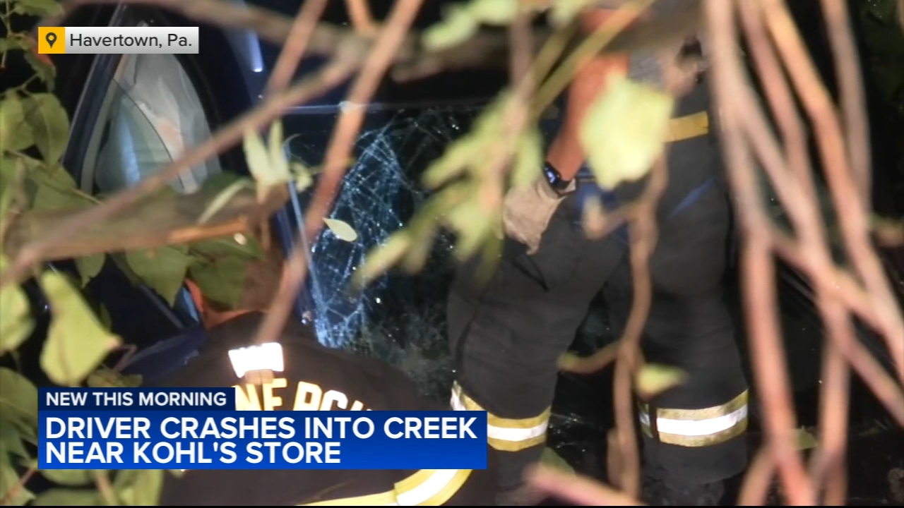 Driver crashes into creek near Delaware Co. department store