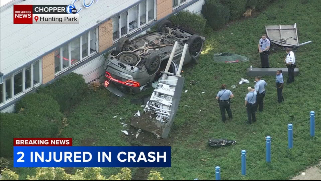 SUV flips over, comes to rest against business in the Hunting Park section of Philadelphia