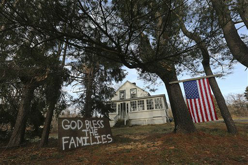 A sign in support of the victim's families is posted outside a house near Sandy Hook Elementary school, Saturday, Dec. 15, 2012 in Sandy Hook village of Newtown, Conn. The massacre of 26 children and adults at Sandy Hook Elementary school elicited horror and soul-searching around the world even as it raised more basic questions about why the gunman, 20-year-old Adam Lanza, would have been driven to such a crime and how he chose his victims. (AP Photo/Mary Altaffer)
