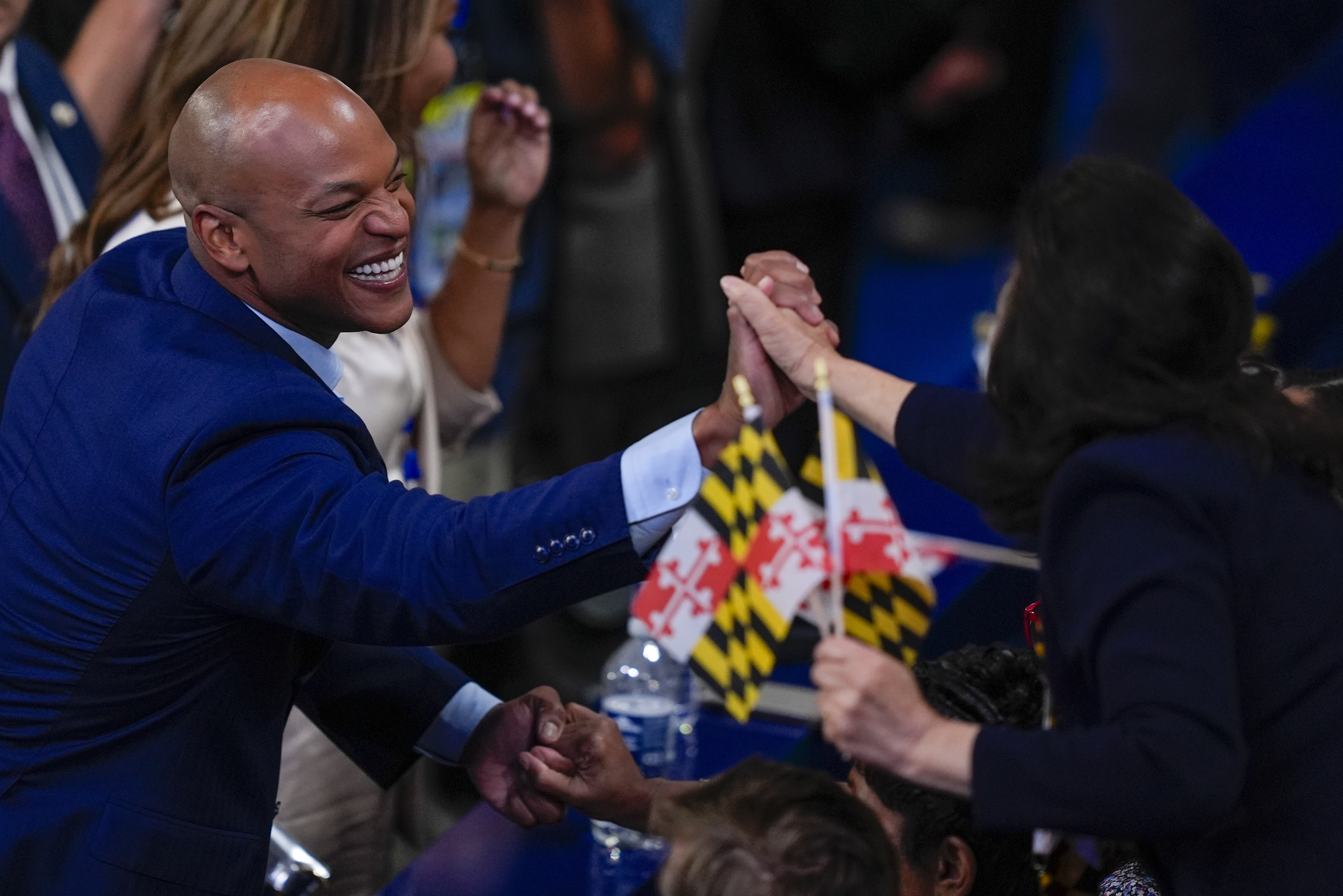 Maryland Gov. Wes Moore shakes hands during the Democratic National Convention Tuesday, Aug. 20, 2024, in Chicago.