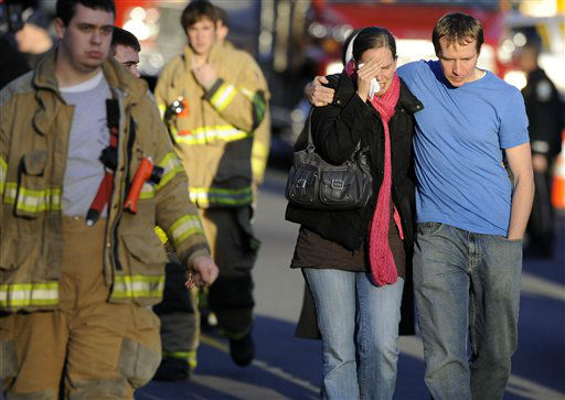 Victims family leave a firehouse staging area following a shooting at the Sandy Hook Elementary School in Newtown, Conn., about 60 miles (96 kilometers) northeast of New York City, Friday, Dec. 14, 2012. An official with knowledge of Friday's shooting said 27 people were dead, including 18 children. (AP Photo/Jessica Hill)