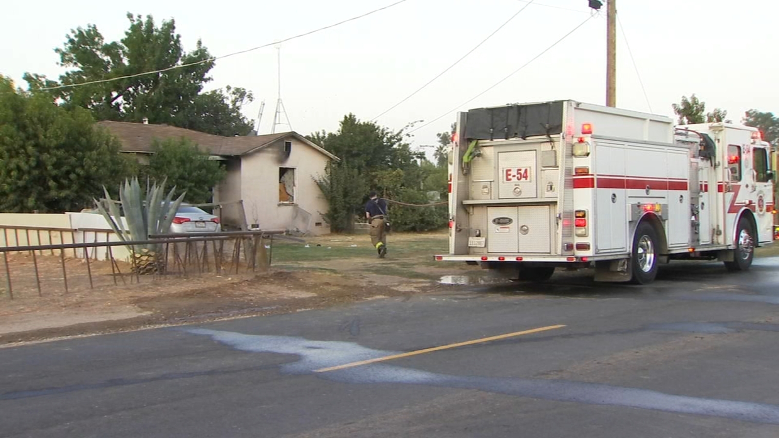 Woman hospitalized following house fire in Fresno County, officials say
