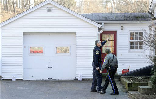 Law enforcement canvass an area nearby a school shooting at the Sandy Hook Elementary School in Newtown, Conn., about 60 miles (96 kilometers) northeast of New York City, Friday, Dec. 14, 2012. An official with knowledge of Friday's shooting said 27 people were dead, including 18 children. (AP Photo/Jessica Hill)