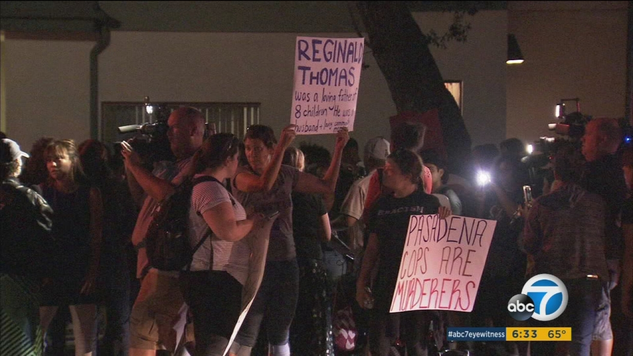 Community members gather to protest the death of an African-American man, who died after being tased by police in Pasadena.