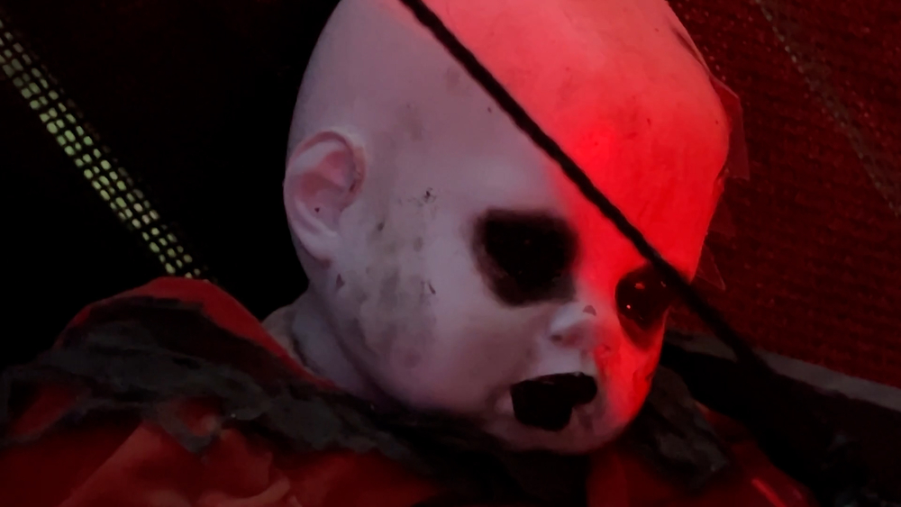 Creepy Halloween doll display invites the brave