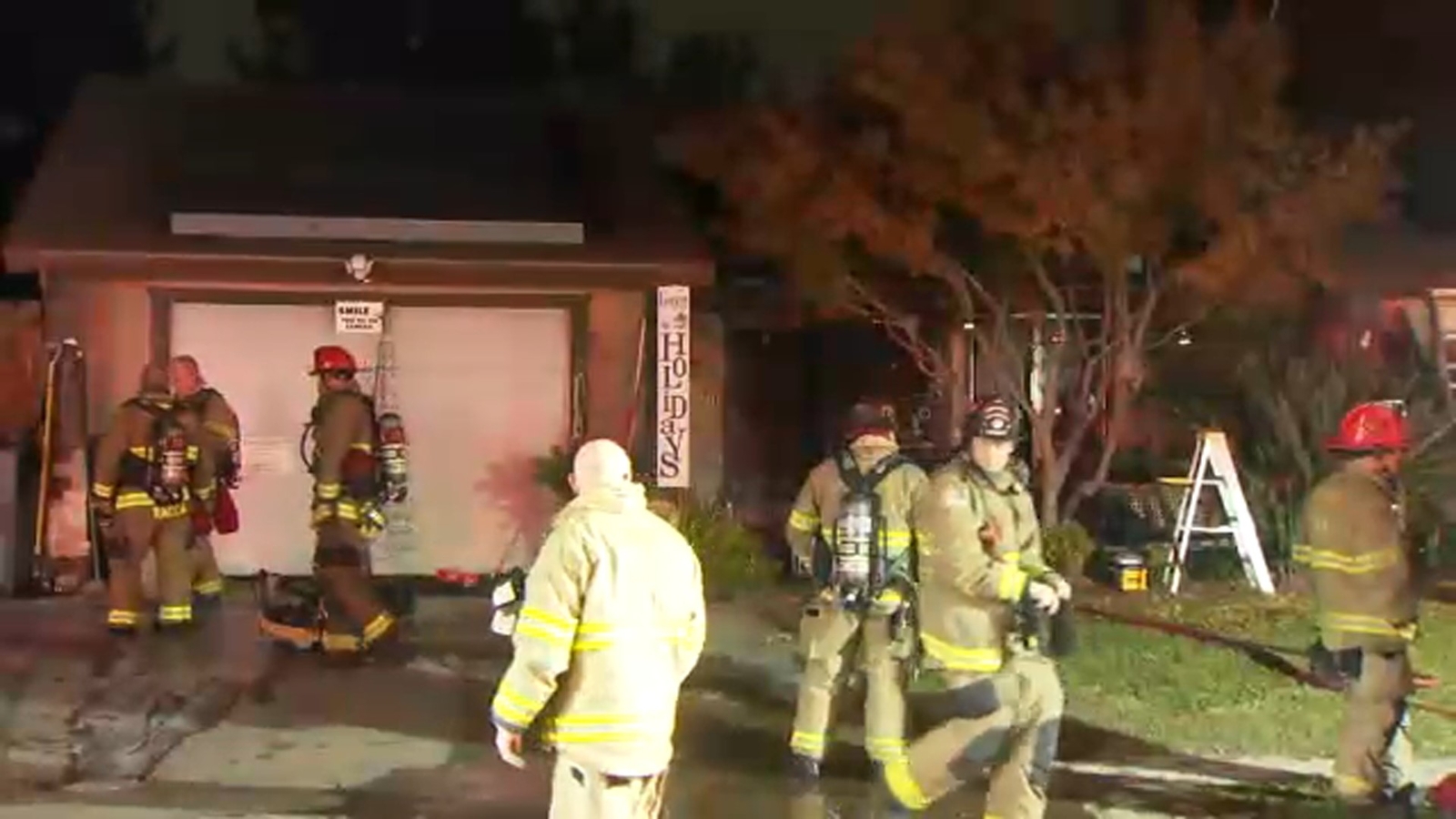 Neighbors pull woman to safety after house catches fire in northwest Fresno