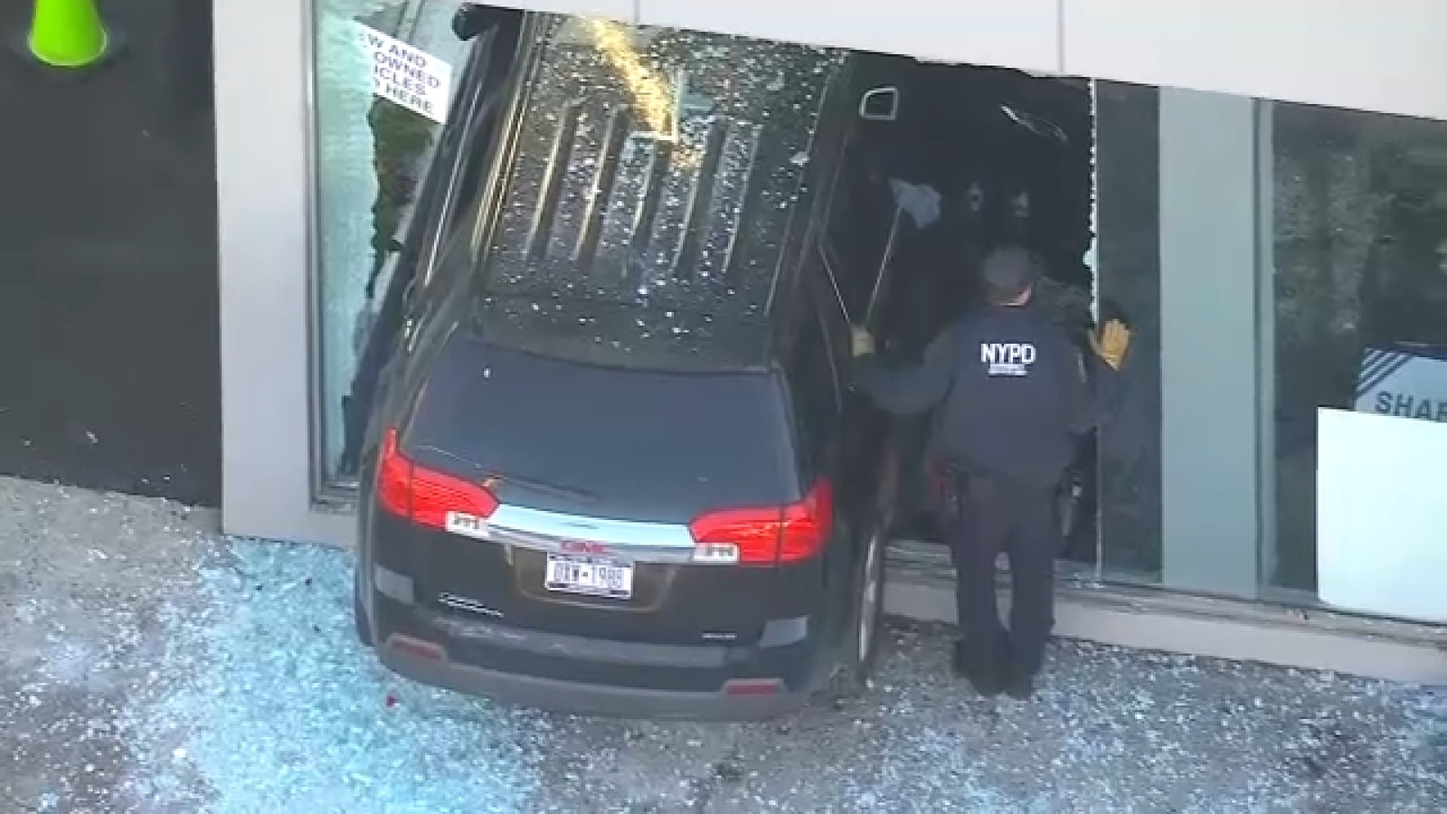 Man suffers medical episode, crashes into Queens car dealership ...