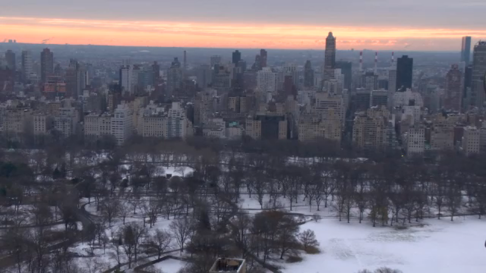 Here are a few options, each with slightly different emphasis, all using the same words:

* Option 1 (Focus on rarity):  Fifteen years later, New York City awakes to its first white Christmas.

* Option 2 (More active voice): A white Christmas awakens New York City for the first time in 15 years.

* Option 3 (Slightly more formal): New York City experienced its first white Christmas in 15 years.
