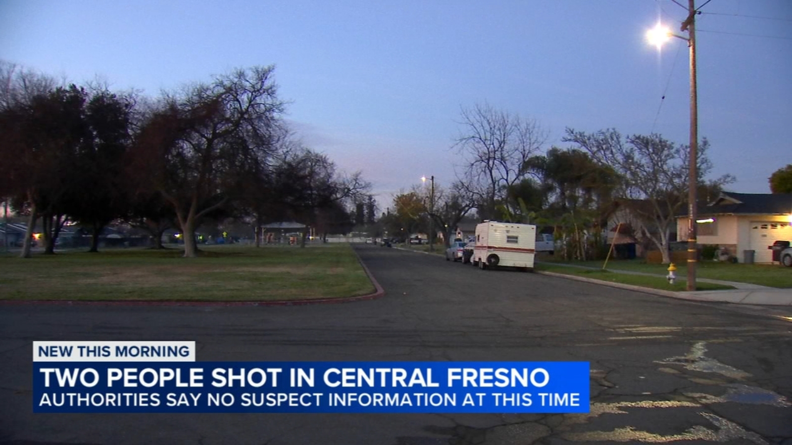 Two people shot while sitting in car, suspect at large, police say