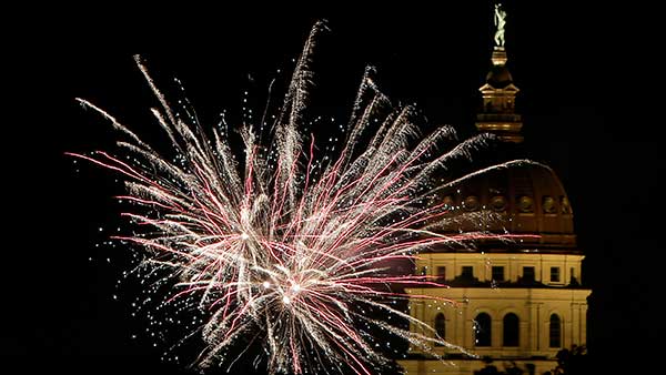 Fireworks explode in front of the Kansas Statehouse during Independence Day celebrations on July 4, 2014, in Topeka, Kan.