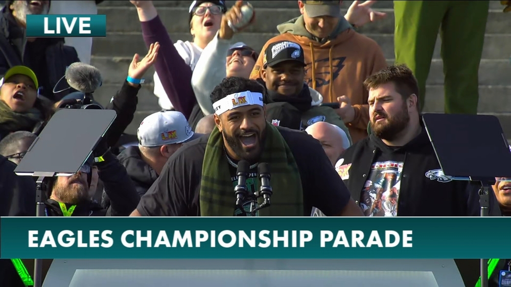 Jordan Mailata leads the crowd in song at championship celebration
