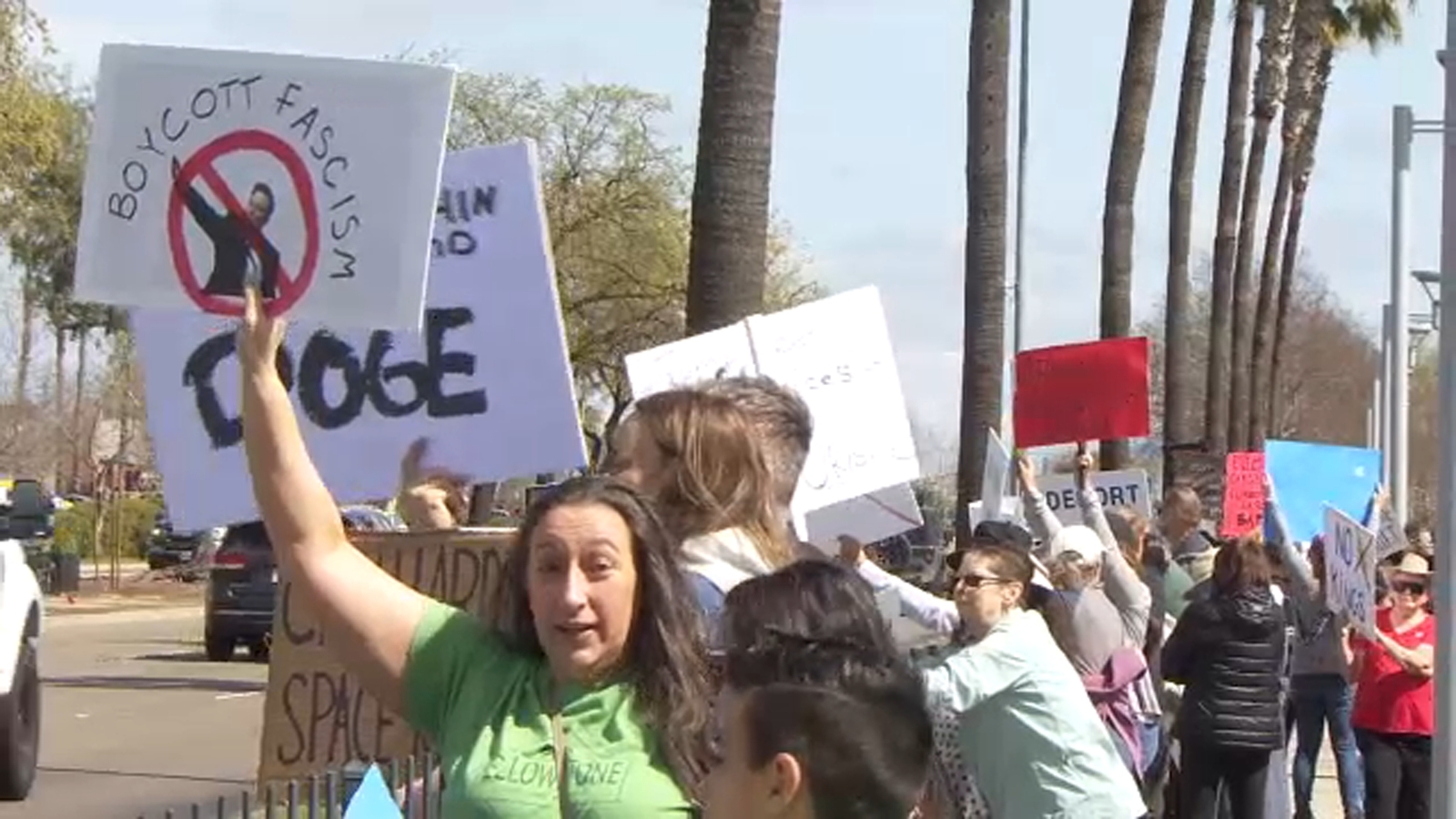 Dozens rally at "Tesla Takedown" protest outside northwest Fresno showroom