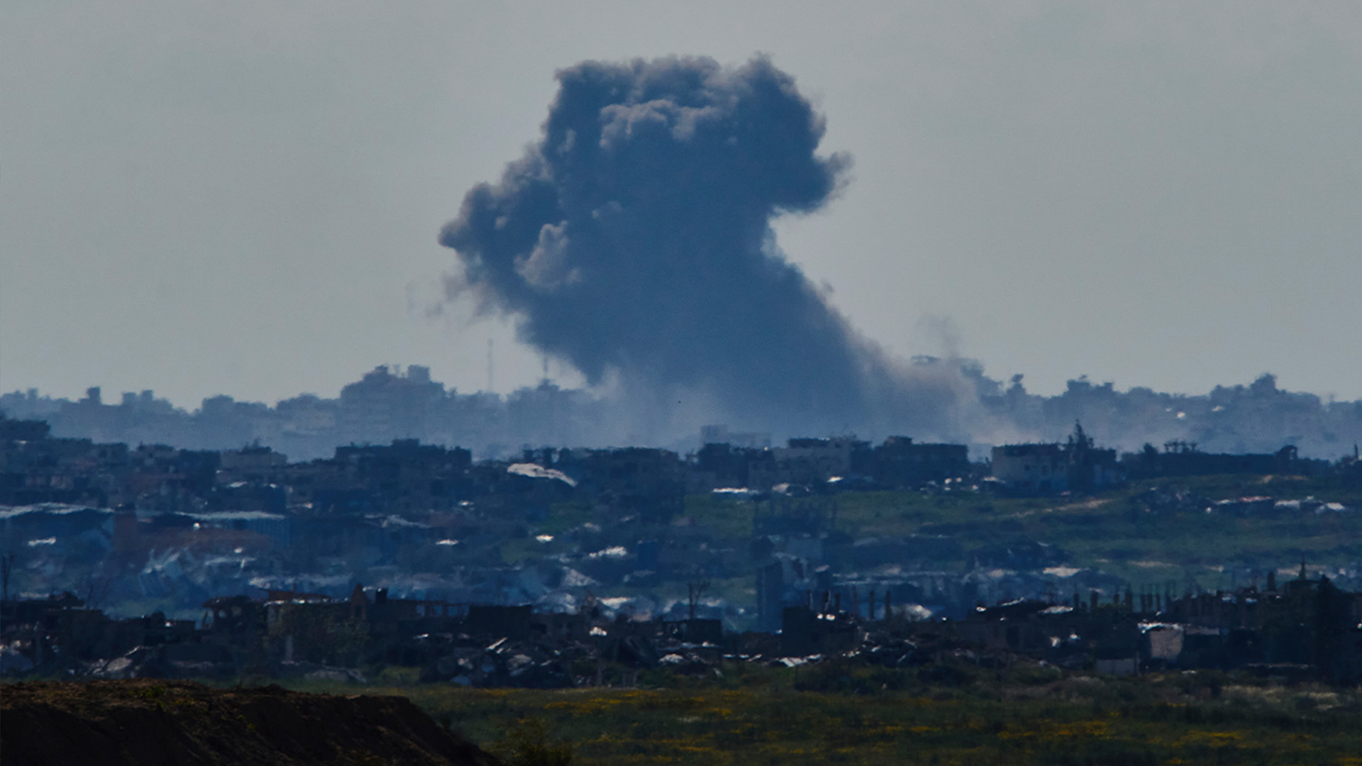 Smoke rises to the sky after an explosion in the Gaza Strip as seen from southern Israel, Sunday, March 23, 2025.