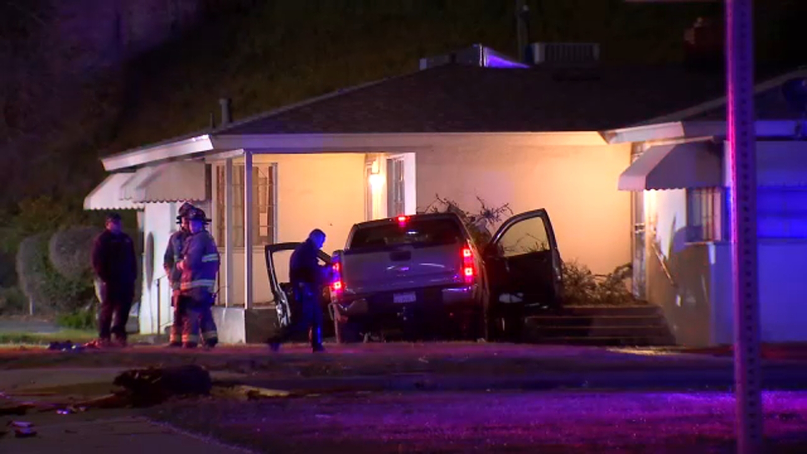 Woman hospitalized after crashing car into home, knocking power out in central Fresno, police say
