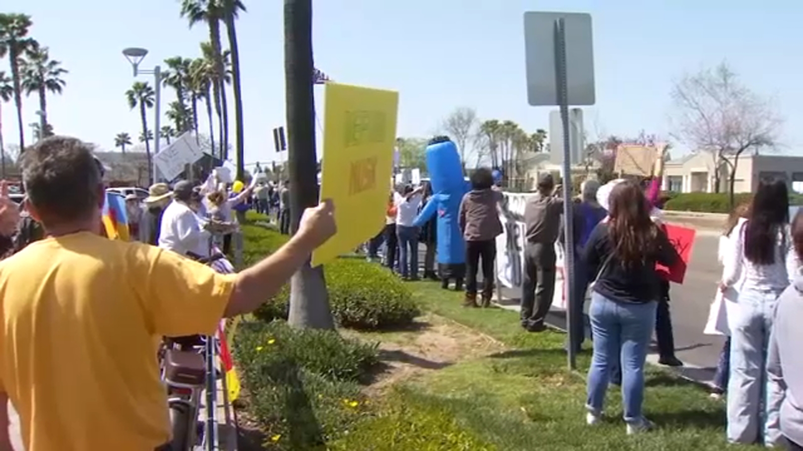 Protesters gather outside Tesla dealership in northeast Fresno